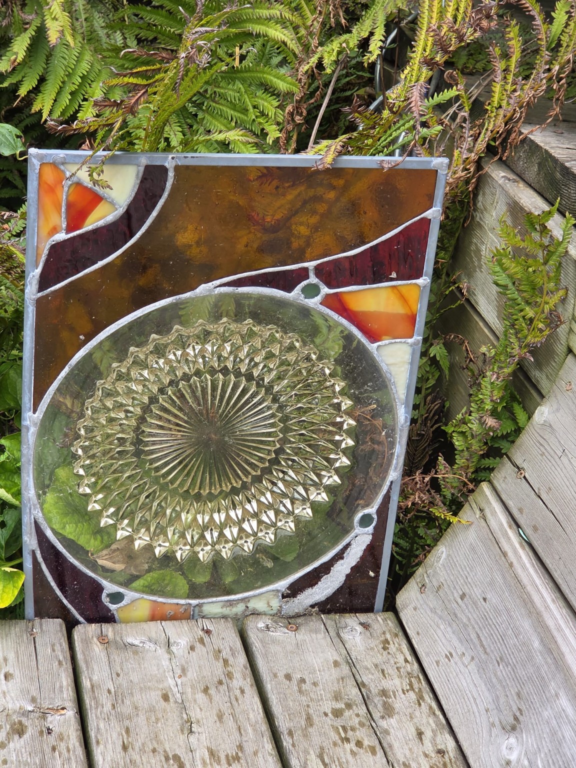 A family glass plate incorporated into an original stained-glass panel
